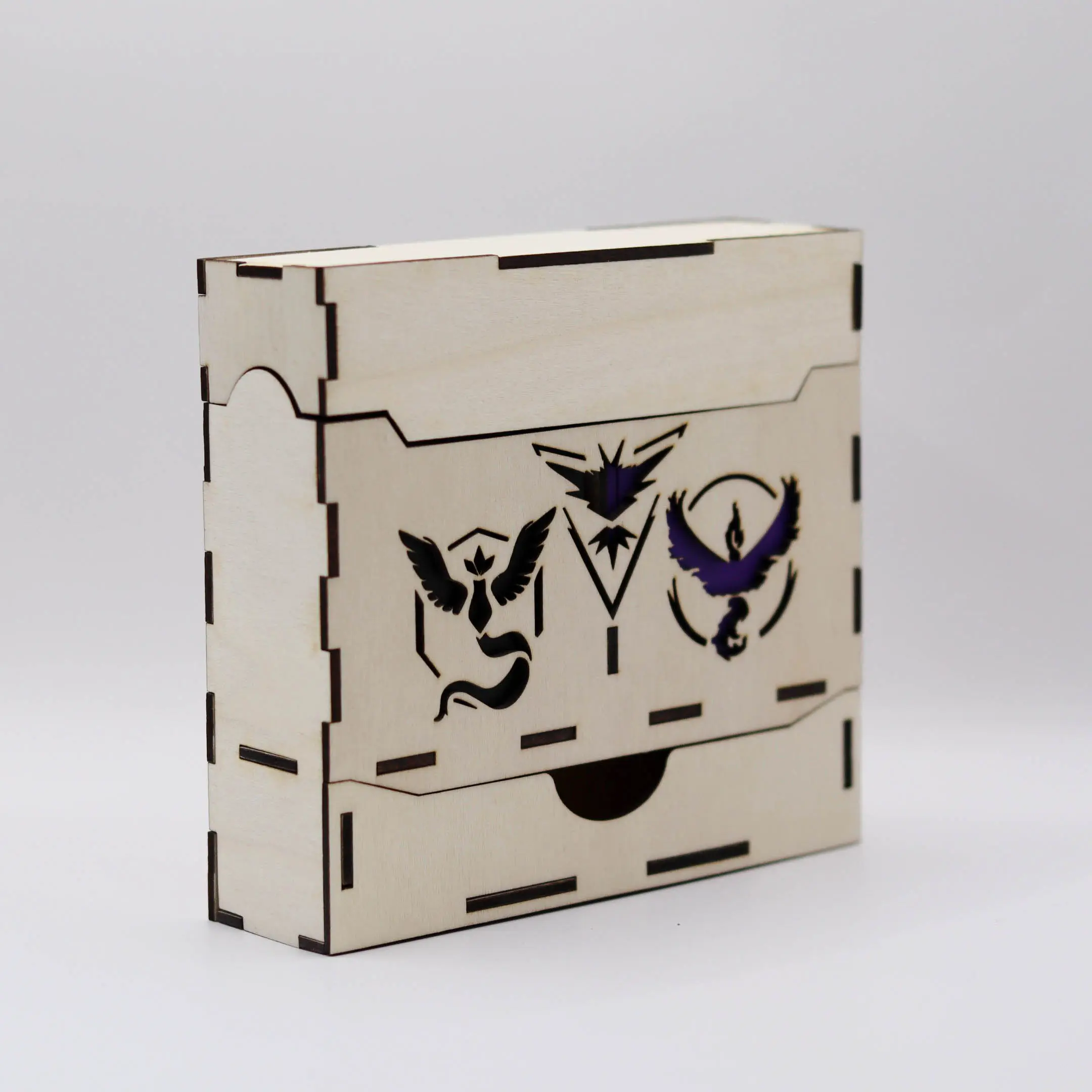 Left-side view of a laser cut wooden deck box with engraved designs.