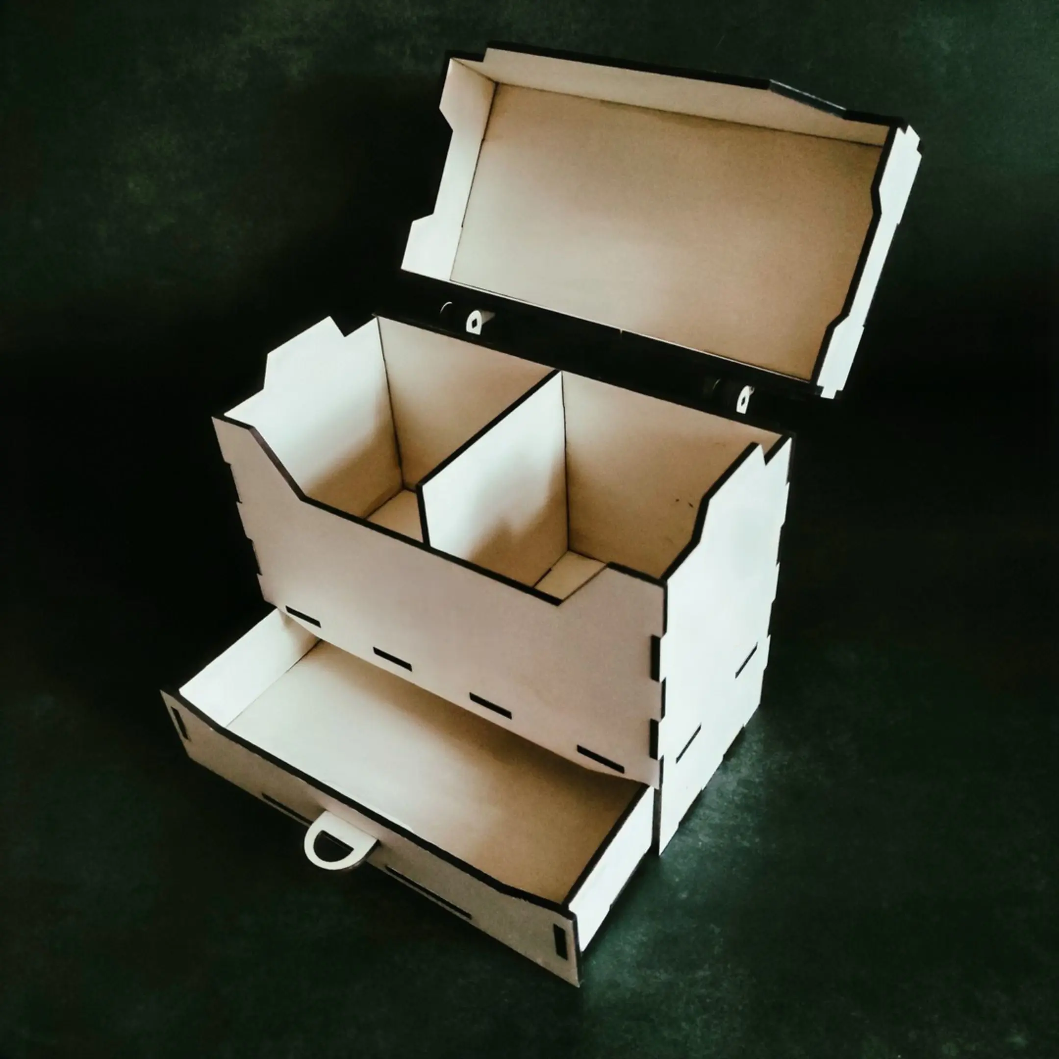 Open universal deck box with empty compartments and pulled-out dice drawer.