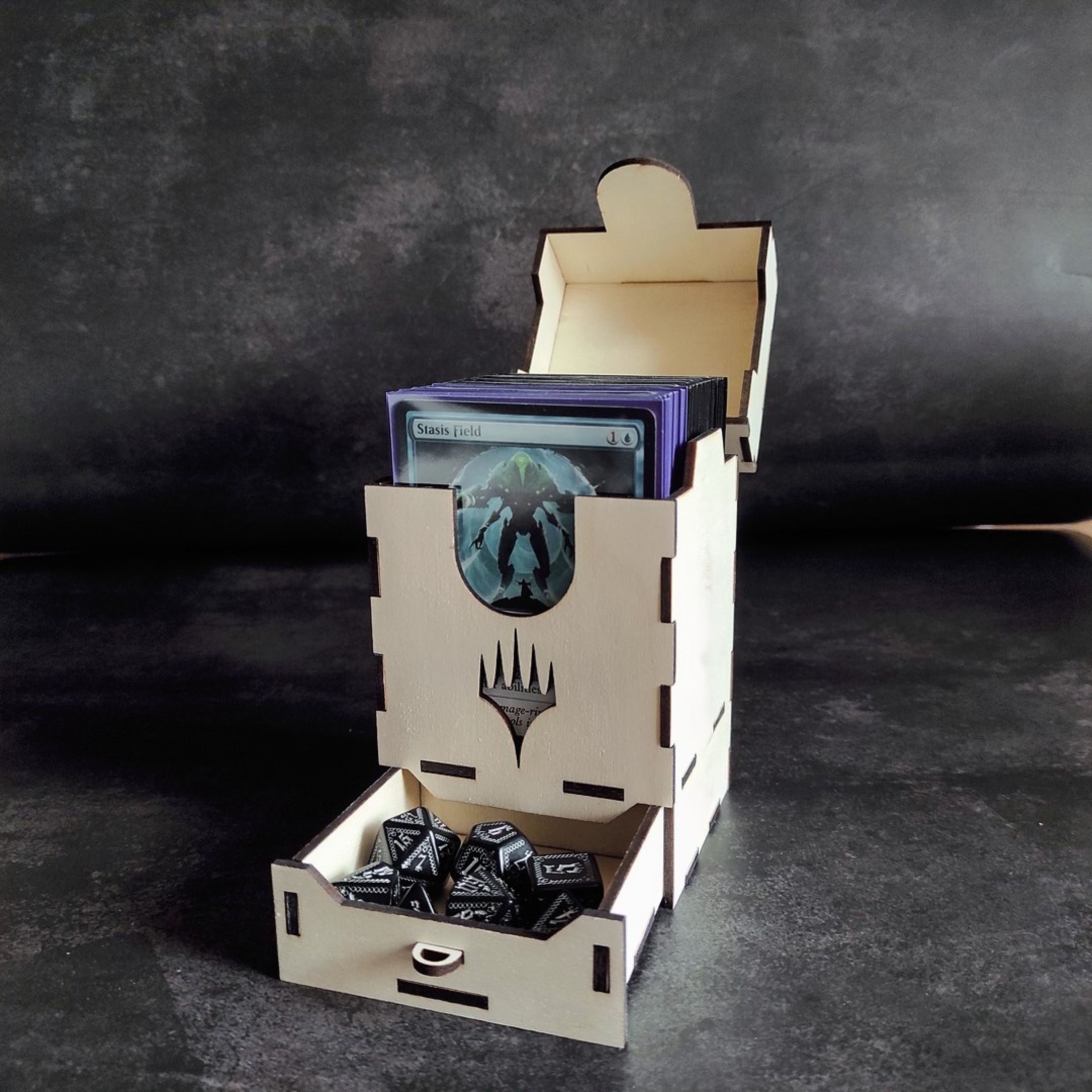Open wooden MTG deck box with sleeved cards and dice drawer.
