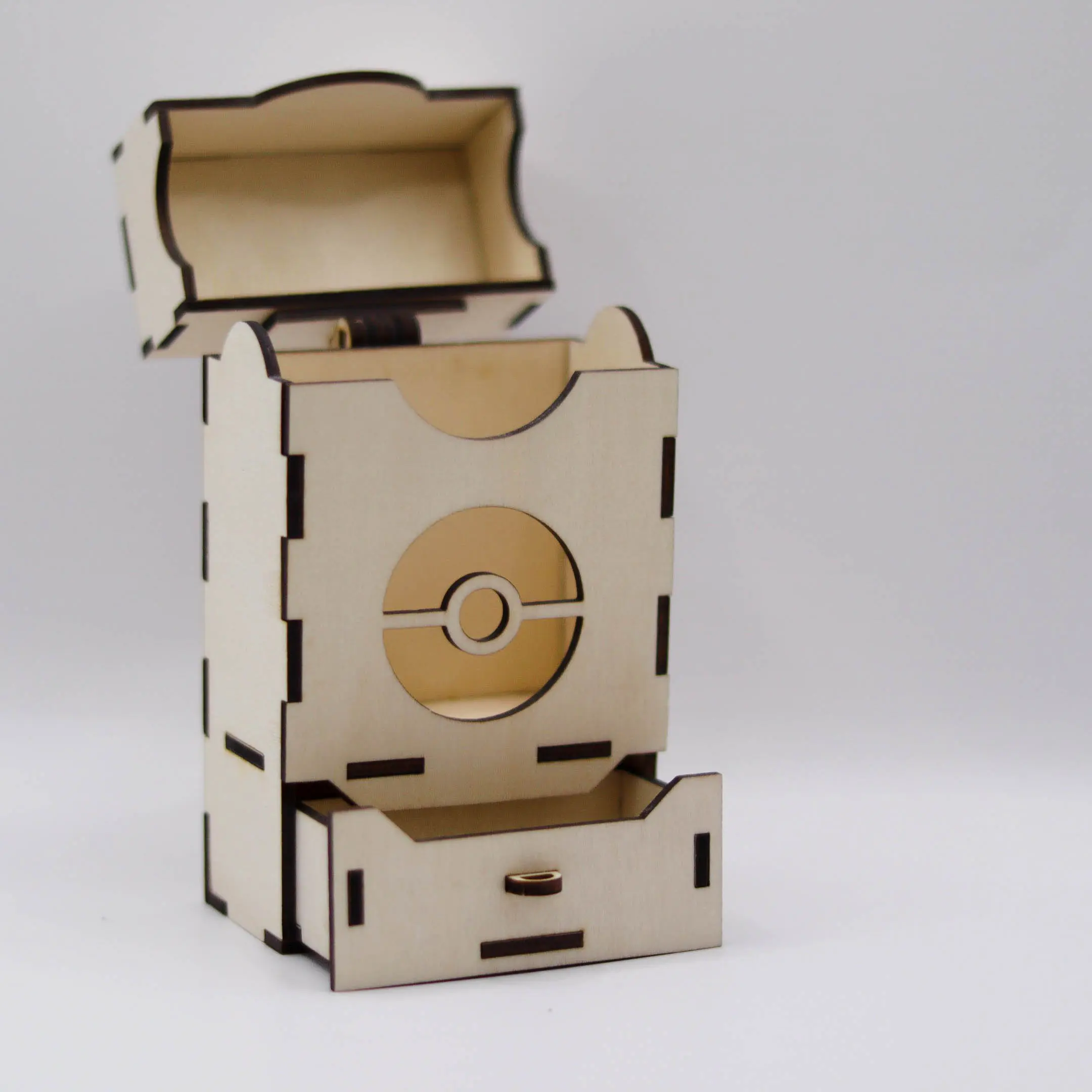 Open laser cut wooden deck box with empty card slot and drawer.
