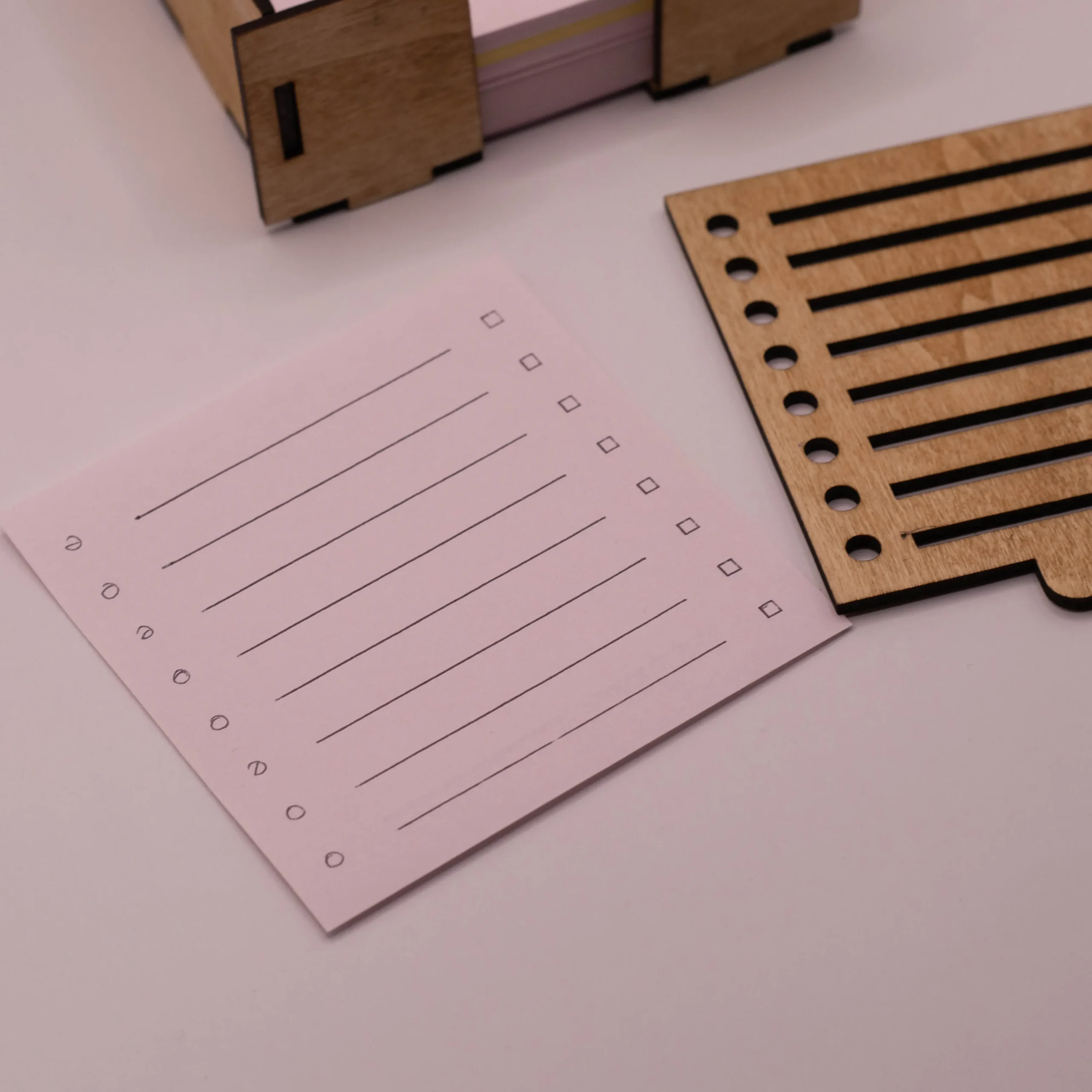 Close-up of a note card with a handwritten checklist created using the laser cut template