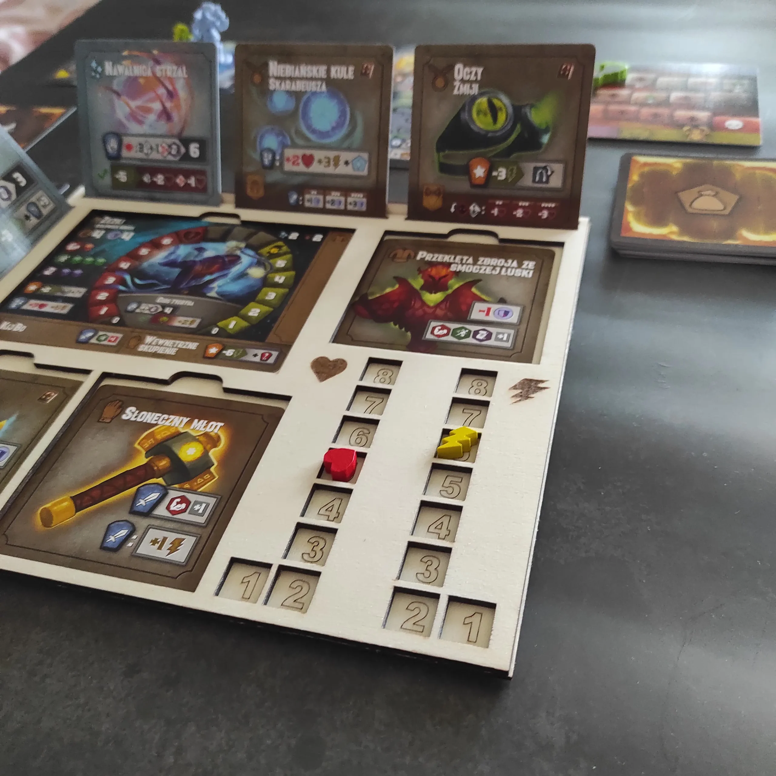 Front view of laser cut Tiny Epic Dungeons player board