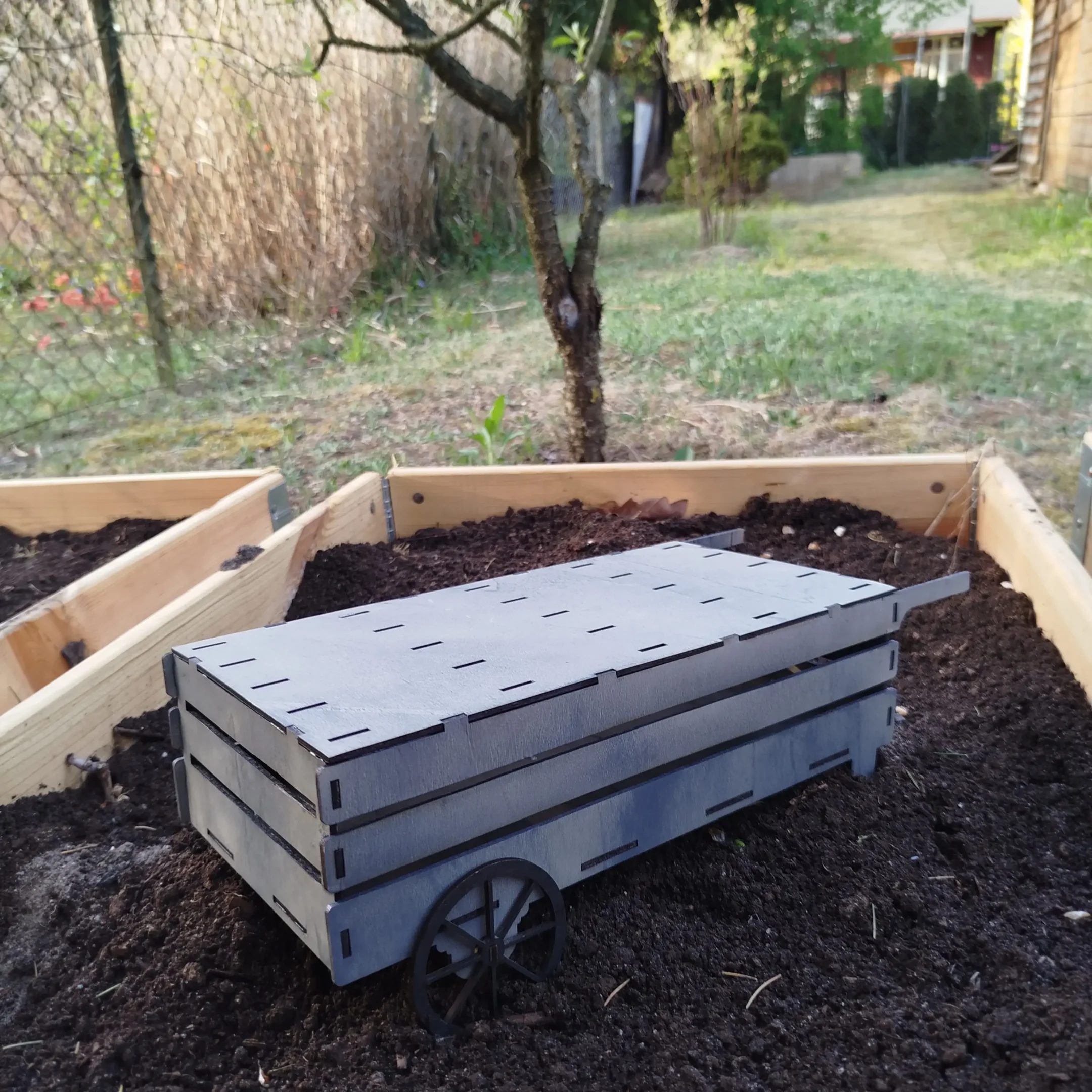 Empty wooden laser cut cart for organizing garden plant markers, ready to be filled