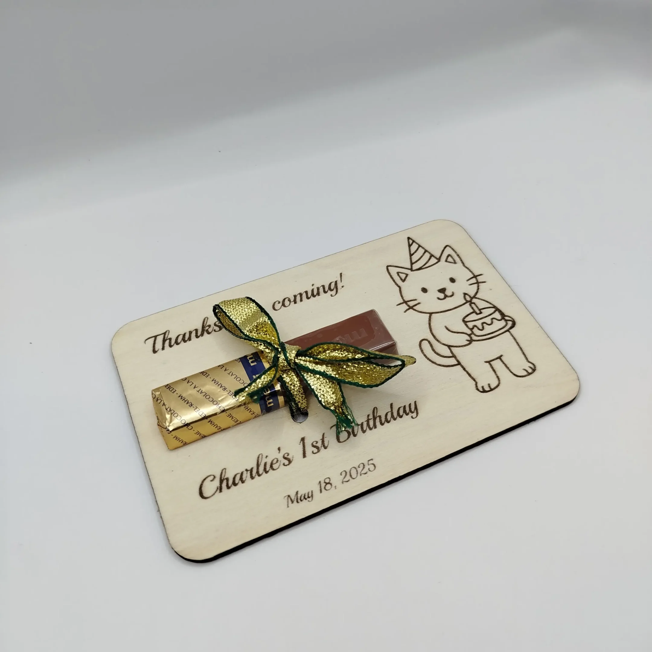 Laser cut cat-shaped wooden party favor with Merci chocolate, customizable gift for guests