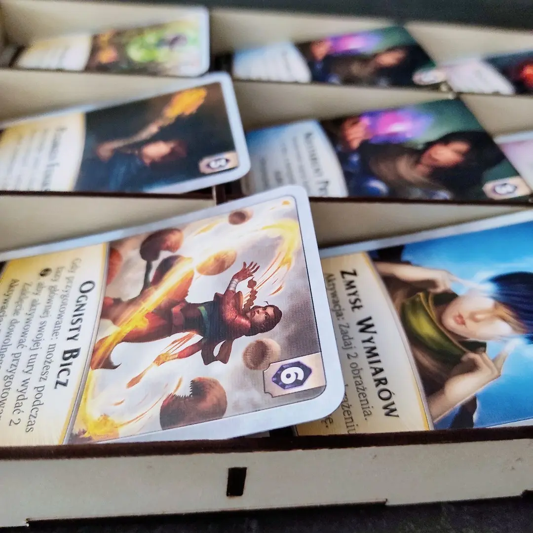 Laser cut Aeon's End market board filled with spell, gem, and relic cards