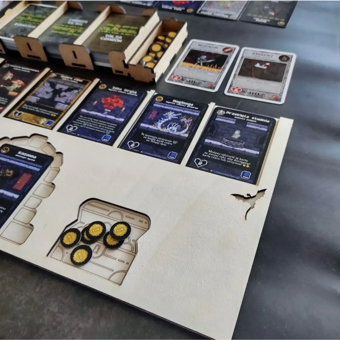 Laser cut Boss Monster player board with game cards and coins