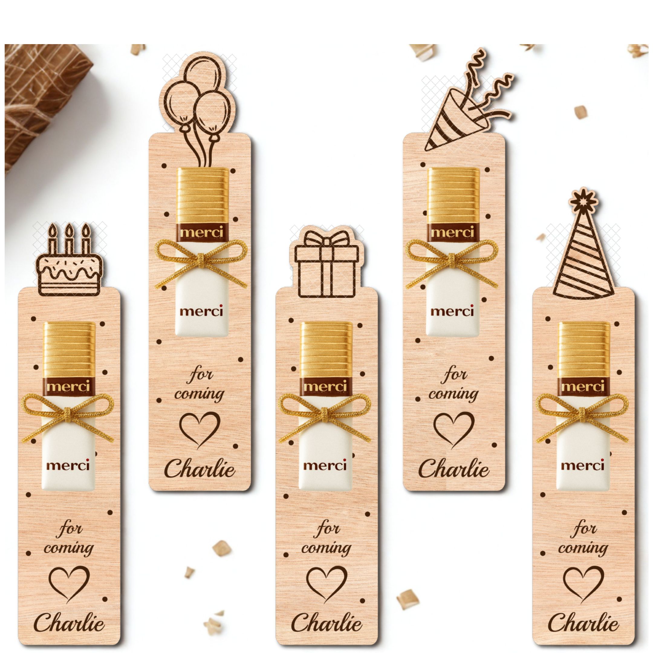 Laser cut birthday party favors in five different animal designs, each with space for a Merci chocolate